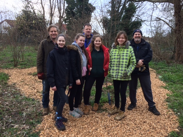 Duke of Edinburgh students in front of orchard